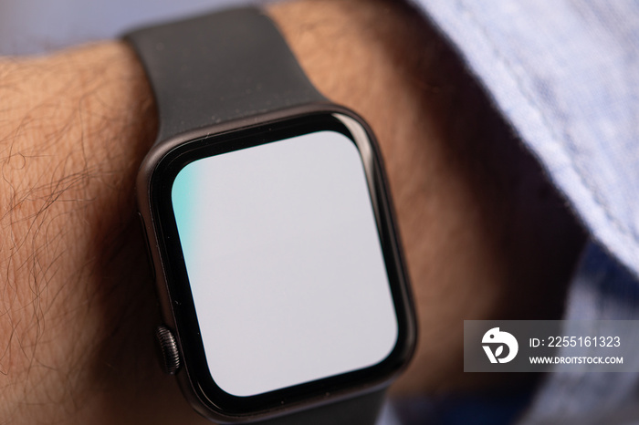 Close up of Businessman’s hand looking at hand watch