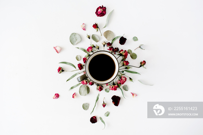 black coffee mug and red rose buds bouquet with eucalyptus on white background. flat lay, top view