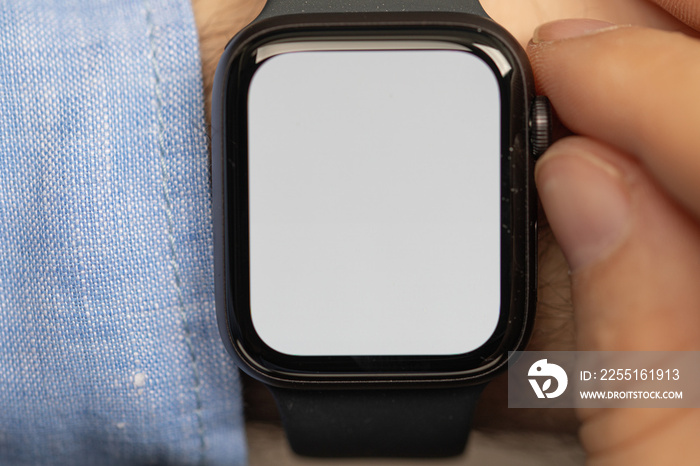 Close up of Businessman’s hand looking at hand watch