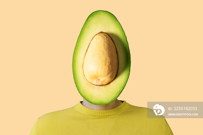 A man with a cut avocado instead of head. Minimal concept.