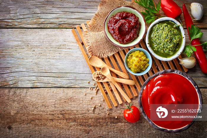 various sauces on wooden table