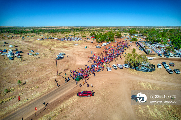 Aerial view of people starting along the Freedom Day Festival march in the township of Kalkaringi in the Northern Territory, Australia on on 26/08/22.