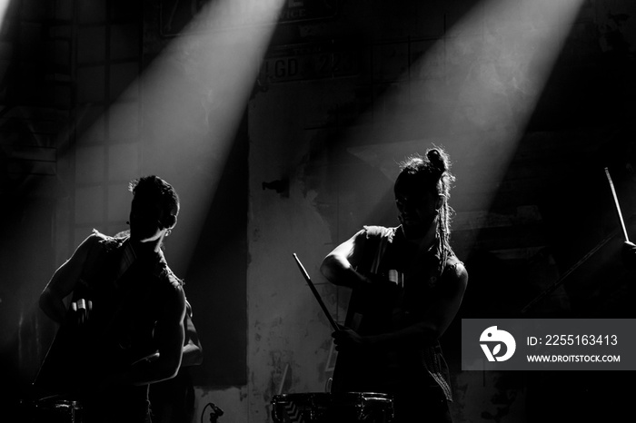 Silhouette of musicians performing on a stage