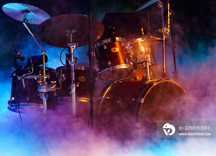 drumset in smoke and colorful light