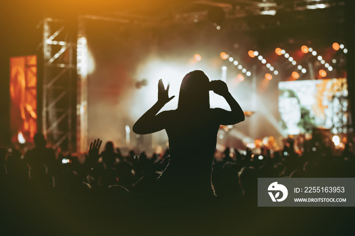 Black silhouette of crowd at concert - enjoy summer music festival.