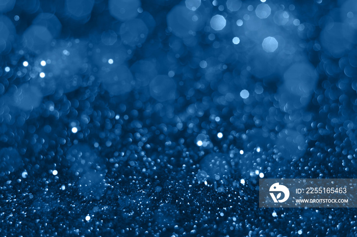 Blue sparkling glitter bokeh background, christmas abstract defocused texture. Holiday lights