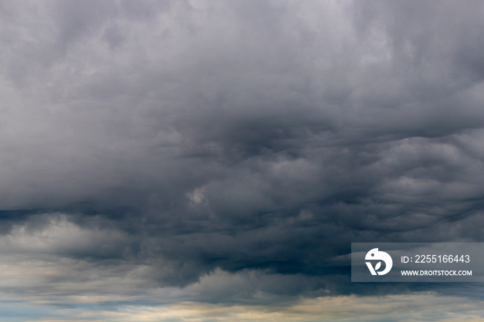 Cloudy in sky before raining, A nimbostratus cloud is a multi-level, amorphous, nearly uniform and often dark grey cloud that usually produces continuous rain, snow or sleet, Horizon nature background