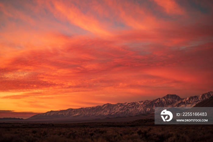 first morning sunlight illuminates snowy mountain peaks in California