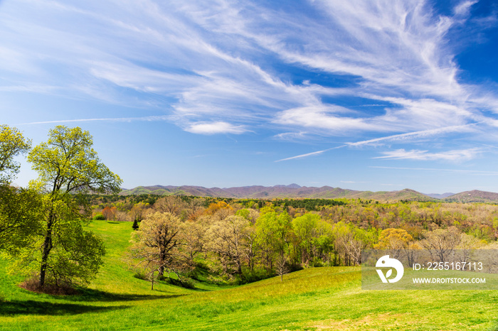 Beautiful rolling hills and the distant Blue Ridge Mountains can be seen in early spring near Asheville, NC, a premier tourist destination in the Southern United States.