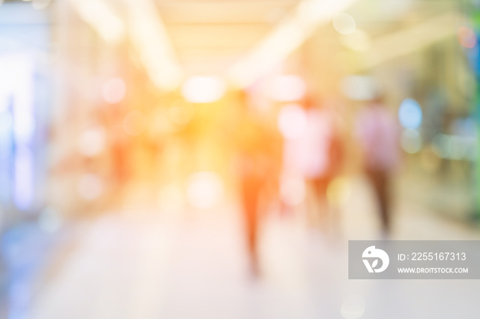 abstract blur defocus background of mall department store with walkway and people shopping