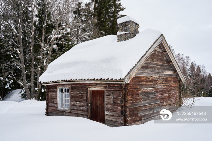 wooden house in the snow