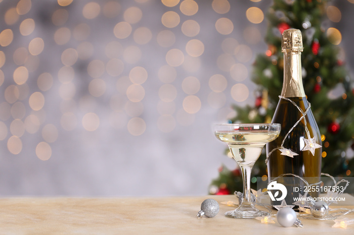 Beautiful christmas composition with two glasses of sparkling wine, decorations on textured table. New year’s eve tradition to celebrate with champagne. Close up, copy space, background.