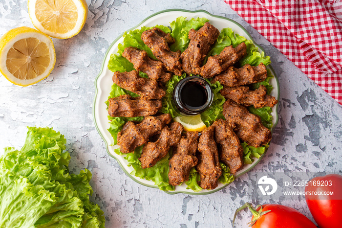 Traditional delicious Turkish food; Turkish name; Cig kofte (raw meatball in Turkish) with lettuce