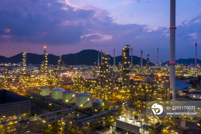 Aerial view of twilight petrochemical oil refinery plants,sea industrial engineering concept at night, Oil and gas tanks pipelines in industry. Modern metal factory. Crude Oil Production.