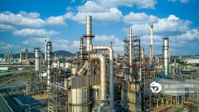 Aerial view oil refinery plant from industry zone, Oil and gas petrochemical industrial, Refinery factory oil storage tank and pipeline steel, Ecosystem and healthy environment.