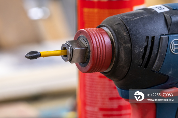 Close up of power drill with screwdriver bit