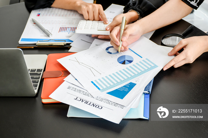 Top view of Businesswoman and partner examining or analyzing resume documents on desk at the office.