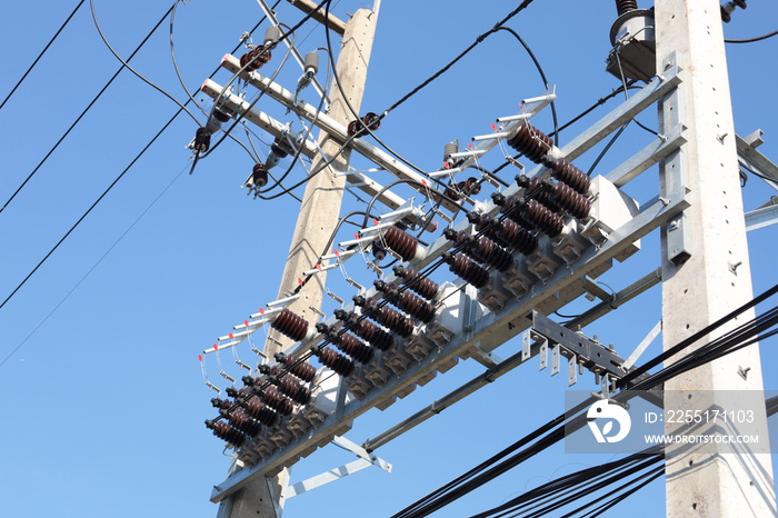 Capacitor bank on pole. close up capacitor bank for increasing control efficiency and reducing voltage loss in high voltage transmission lines on blue sky background with copy space. selective focus