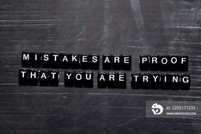 Mistakes are proof that you are trying on wooden blocks. Education, Motivation and inspiration concept