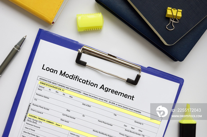 Financial concept meaning Loan Modification Agreement with phrase on the business paper