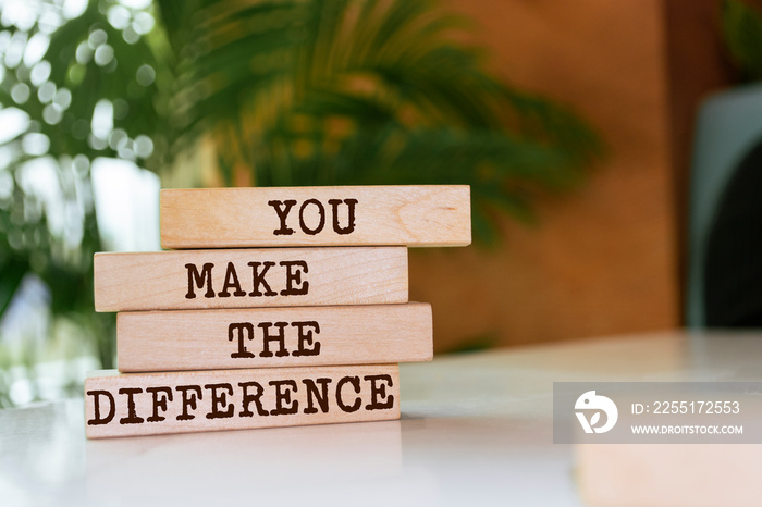 Wooden blocks with words ’You Make The Difference’.