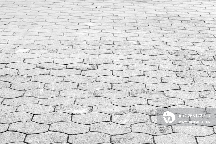 Top view on gray paving stone road. Old pavement of granite texture. Street cobblestone sidewalk. Abstract background for design.