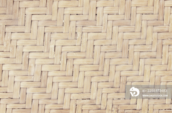 Old bamboo weaving pattern, woven rattan mat texture for background and design art work.