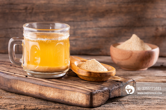 Maca root health drink in a glass with powdered - Lepidium meyenii.