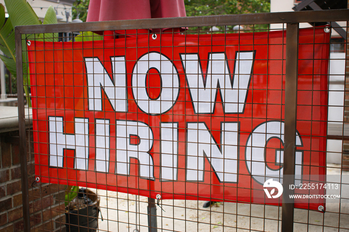 Bright red now hiring sign