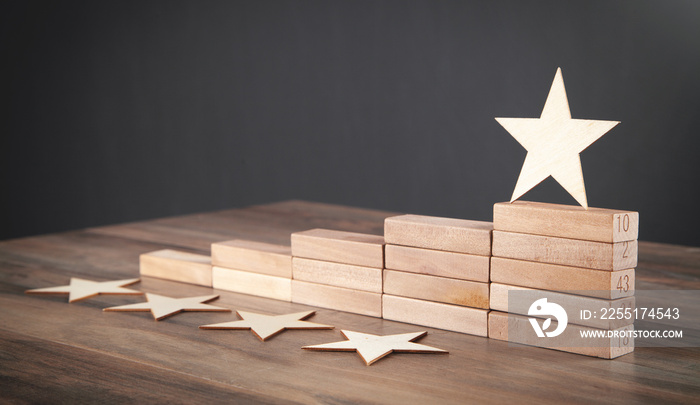 Wooden 5 stars and wooden blocks. Increase rating