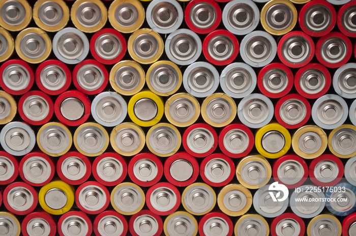 closeup of red and silver aa alkaline batteries stack on full frame