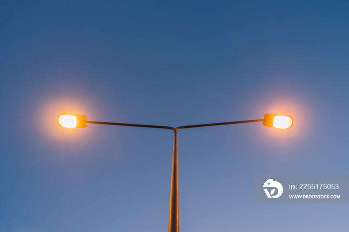 Upper view of light street pole on sunset time.