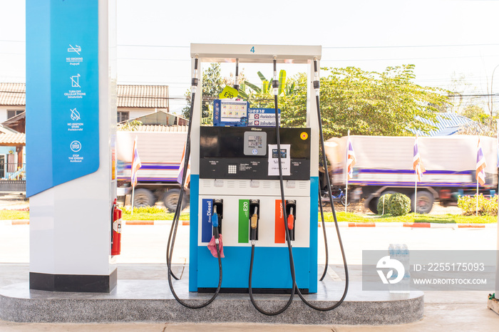 Lampang gas station, Lampang, Thailand : Fuel oil dispenser in petrol filling station. Fuel nozzle at a gas station.