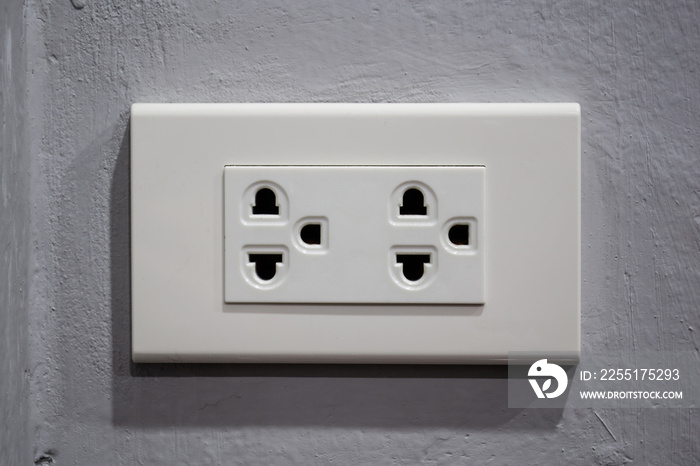 Electric plug socket type b on concrete wall