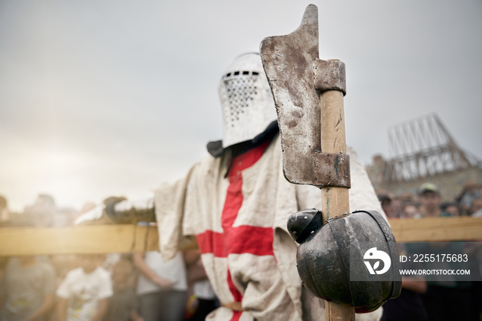 Crusader holding axe.