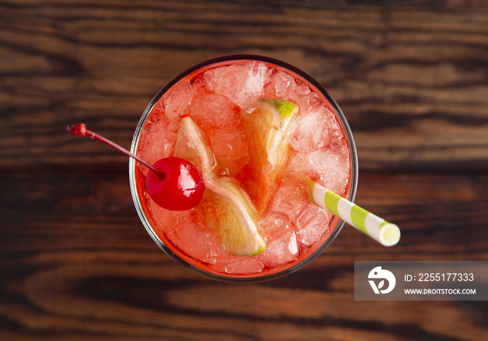 Glass of Cold Refreshing Cherry Limeade on a Wooden Table