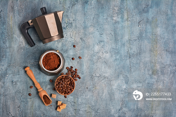 Top view on open geyser coffee maker with ground coffee and beans for morning espresso