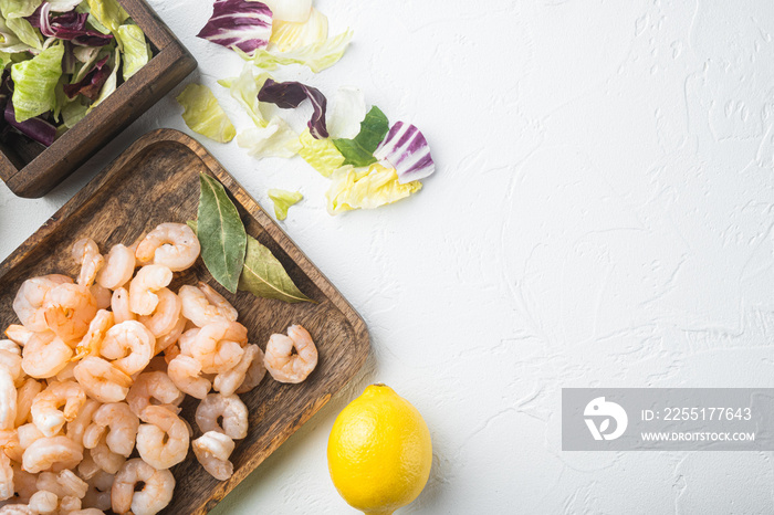 Seafood salad or appetizer shrimp and other ingredients, with sauce apple and grape, on white stone  background, top view flat lay, with copy space for text