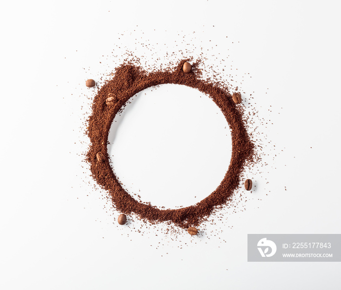 Coffee beans and coffee powder with round copy space.