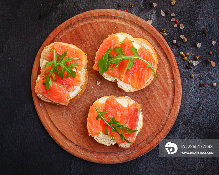 sandwich salmon smorrebrod (delicious snack seafood fish) menu concept. food background. top view. copy space