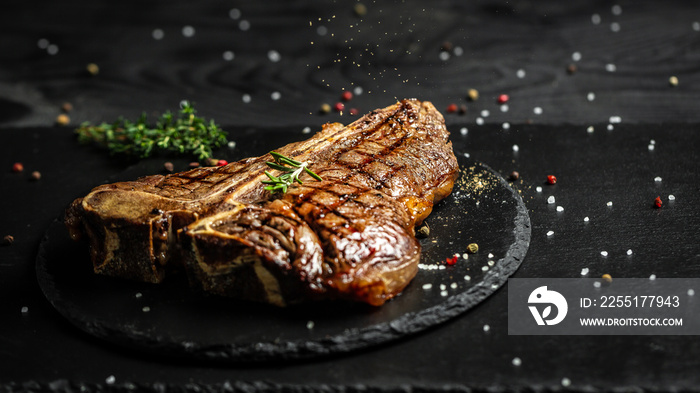 T-bone grilled beef steak. Dry Aged Barbecue Porterhouse Steak. Medium rare. American cuisine. Long banner format, top view