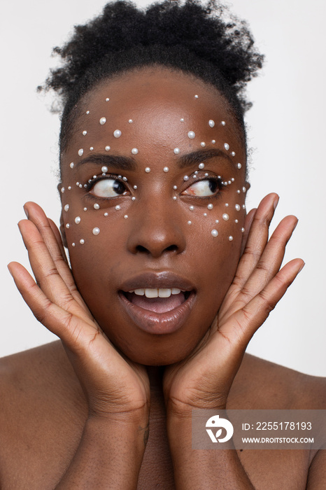 Young woman wearing pearl freckles