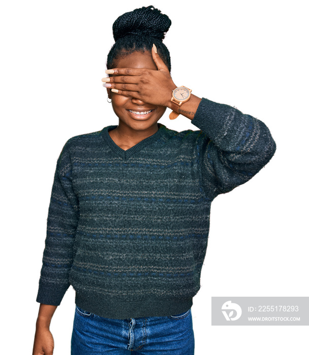 Young african american woman wearing casual clothes smiling and laughing with hand on face covering eyes for surprise. blind concept.