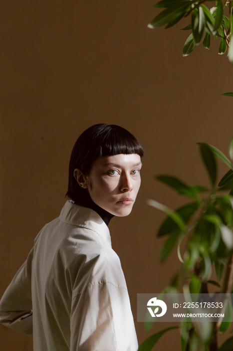 Portrait of a beautiful girl in stylish clothes with a short haircut