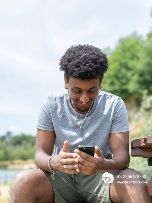 Smiling man during video call on sunny day