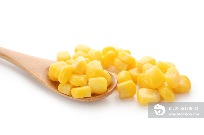 Wooden spoon of corn kernels on white background