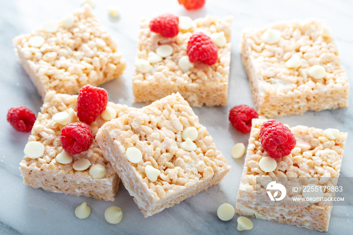 Rice crispy marshmallow treats with white chocolate and raspberries