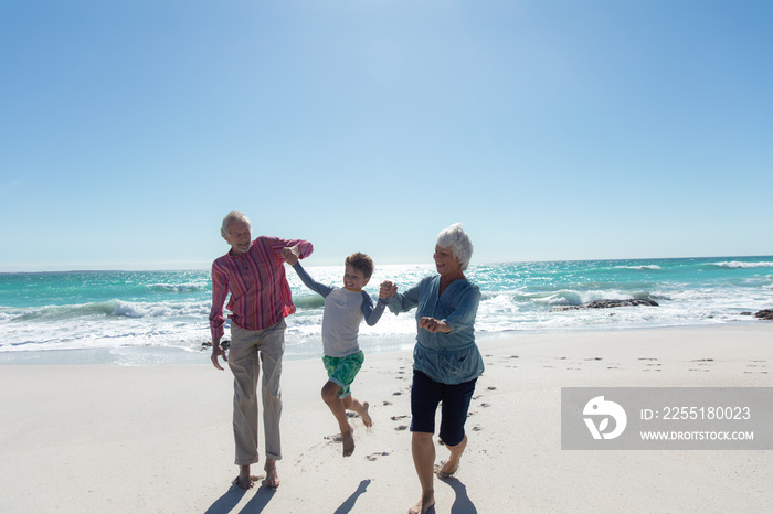 Grandparents and grandson at the beach