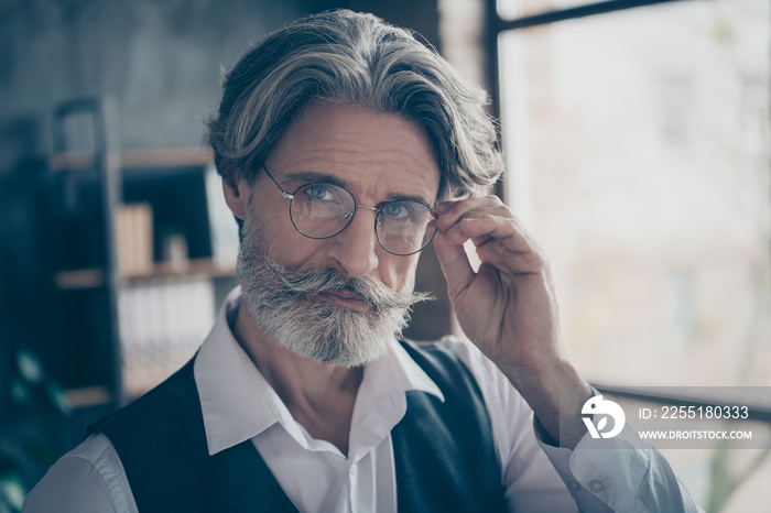 Close-up portrait of his he nice attractive intellectual experienced gray-haired man top specialist expert touching specs view sight at modern loft brick industrial style interior work place station