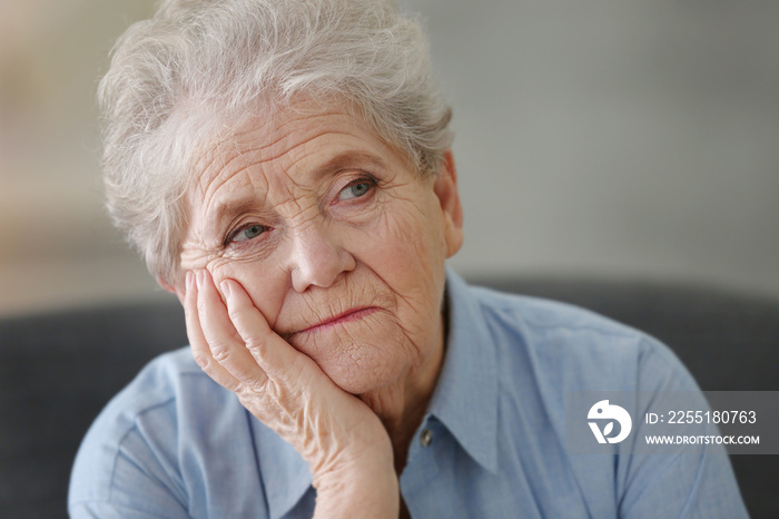 Depressed elderly woman at home